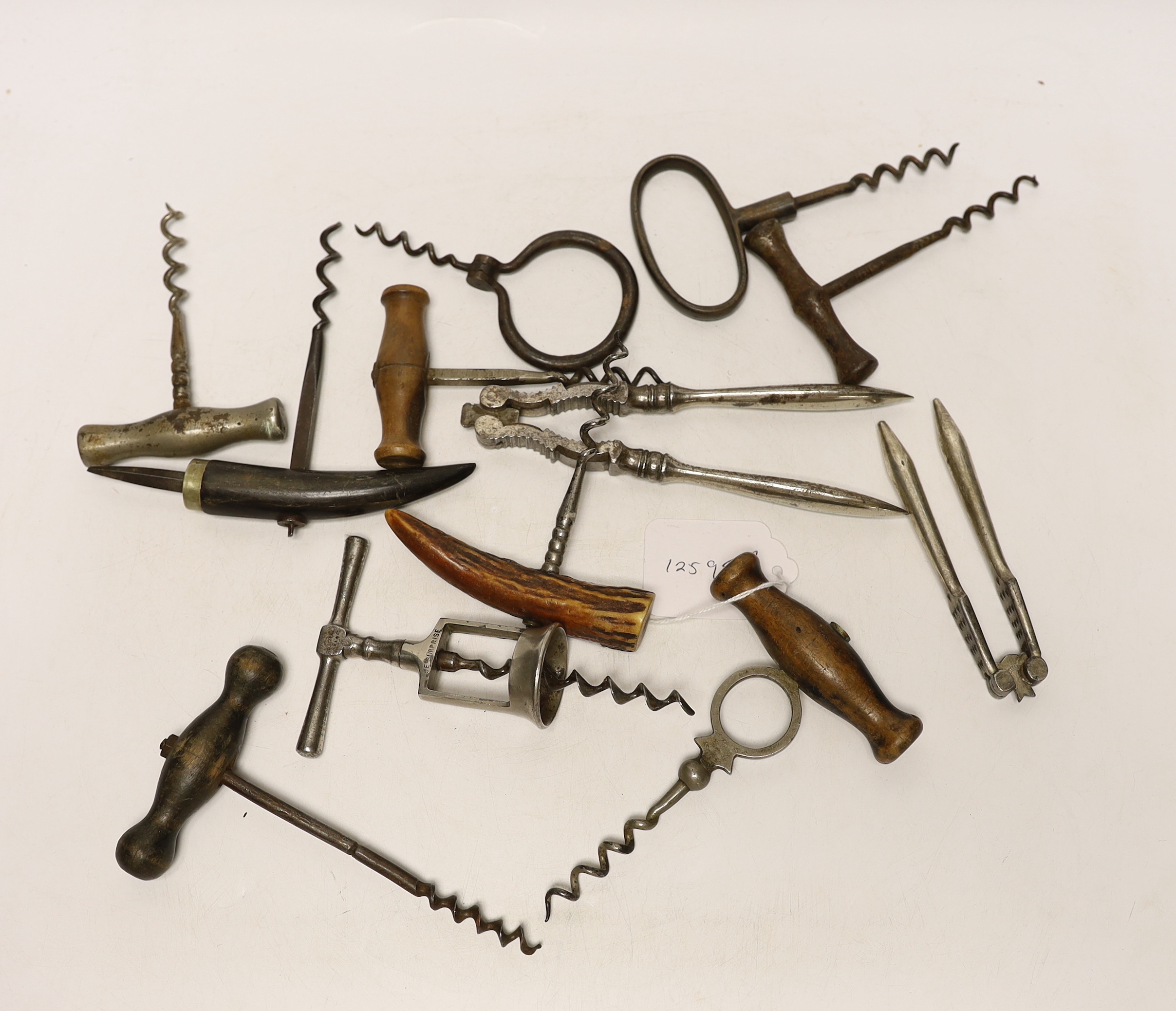 A collection of 19th century and later corkscrews and two nutcrackers